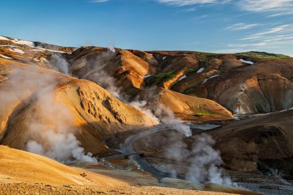 Geysers in hilly Icelandic landscape